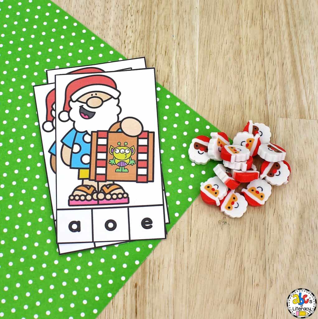 Free printable Summer Santa Beginning Sounds Activity: identify pictures and letter sounds and develop fine motor skills with clip cards. Clip Cards
