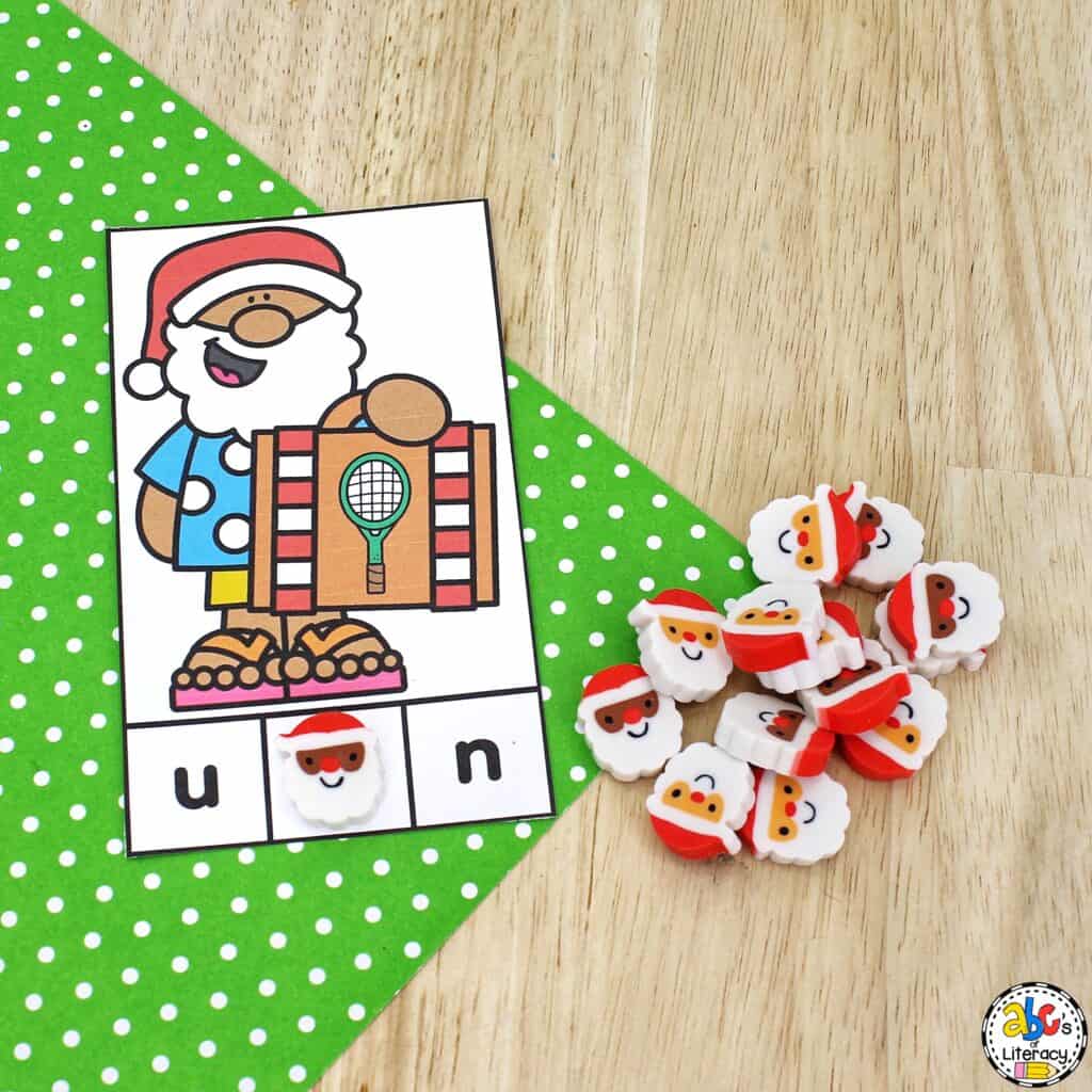 Free printable Summer Santa Beginning Sounds Activity: identify pictures and letter sounds and develop fine motor skills with clip cards. Phonics Activity