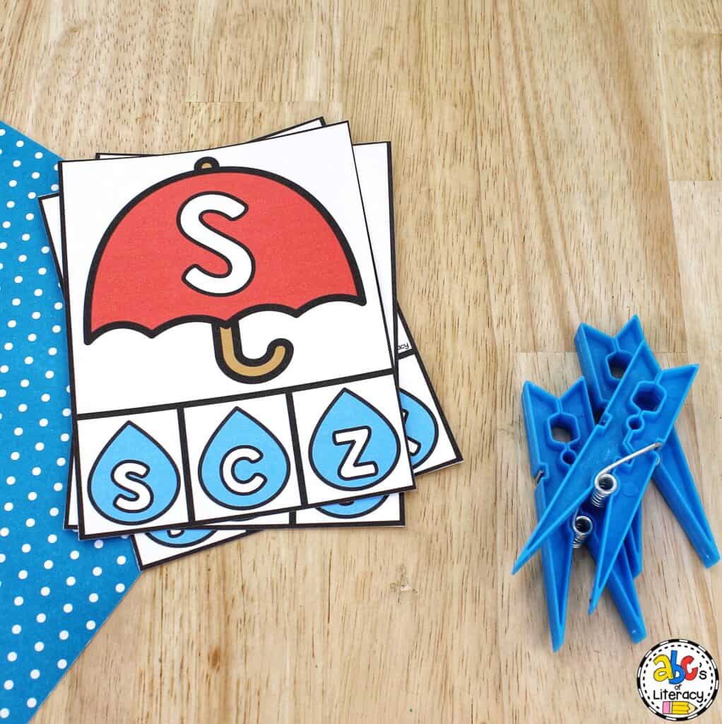 Free printable Umbrella Alphabet Clip Cards for preschool: Work on letter recognition, matching letters, fine motor skills, and more! letter clip cards